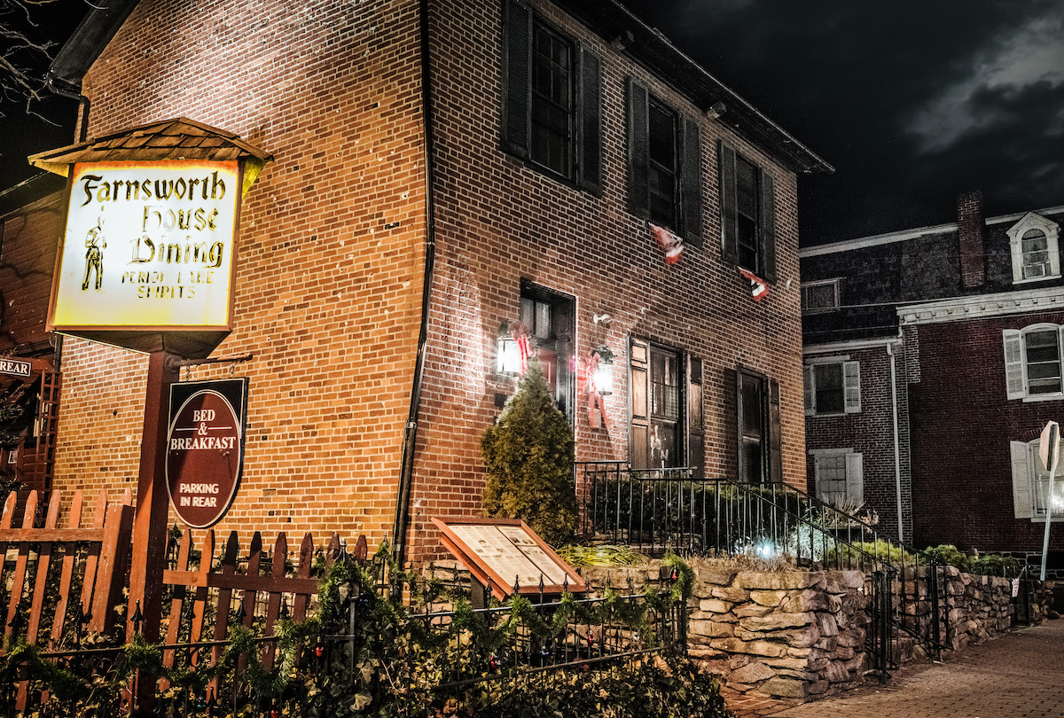 The Farnsworth House Inn at night with lamplights, in Gettysburg, Pennsylvania, a haunted location and Inn on the US Ghost Adventures Gettysburg ghost tour