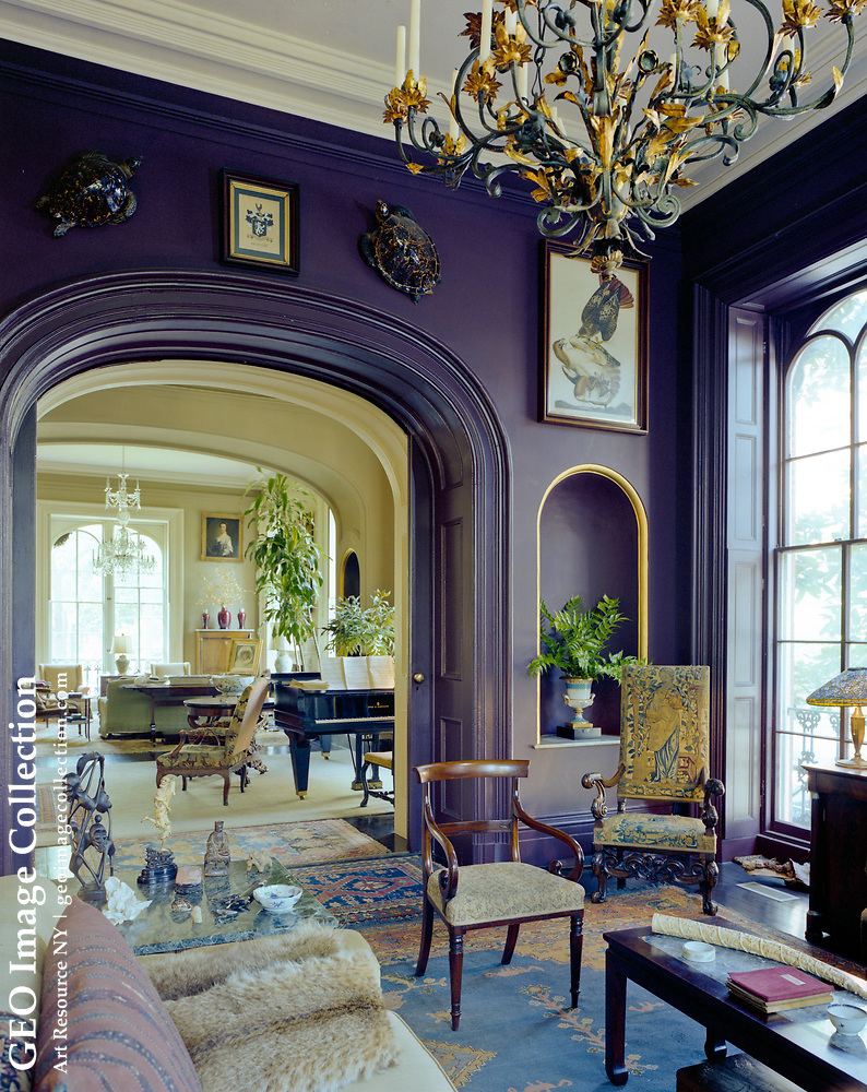 photo shows a sitting room in the home, with lavish decor and bright paints
