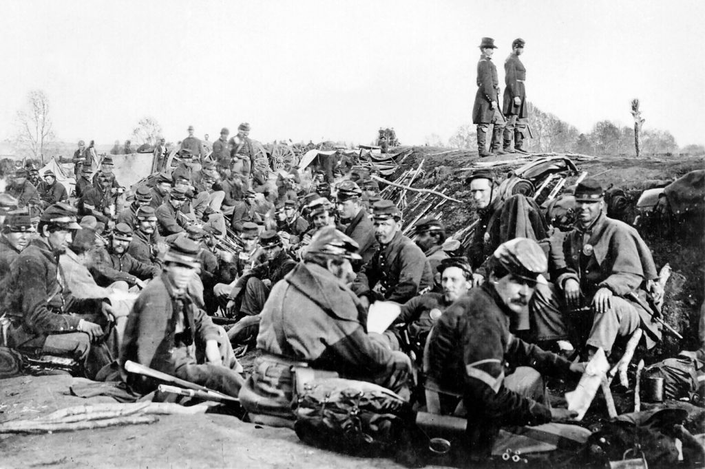 photo shows a sea of union troops sitting in a field outside of Fredericksburg, Virginia.
