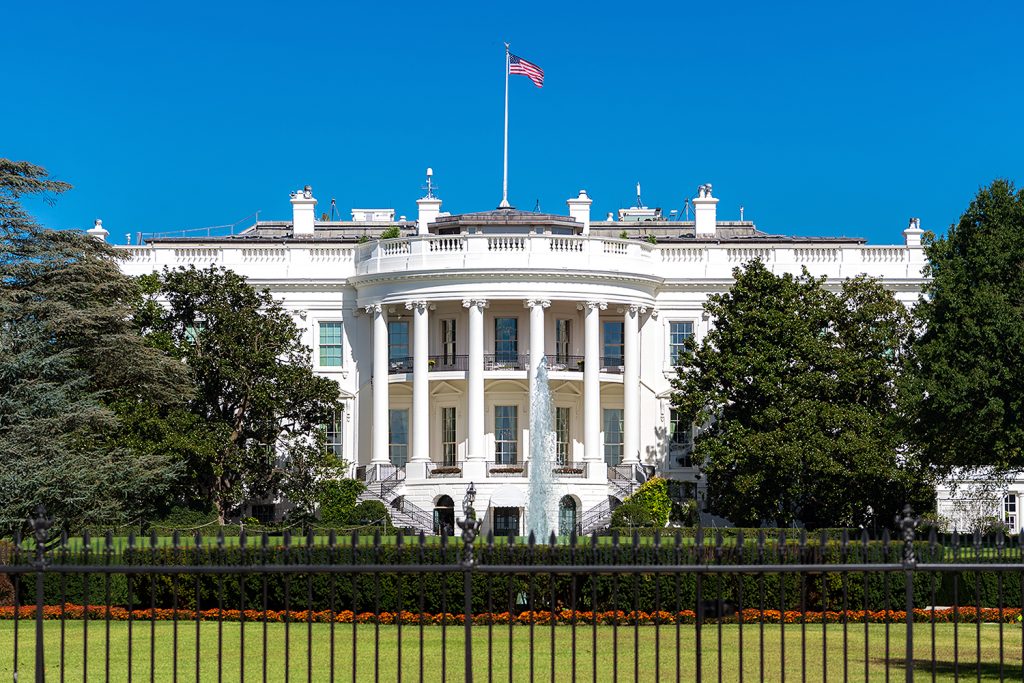 photo shows the facade of the white house from its front lawn