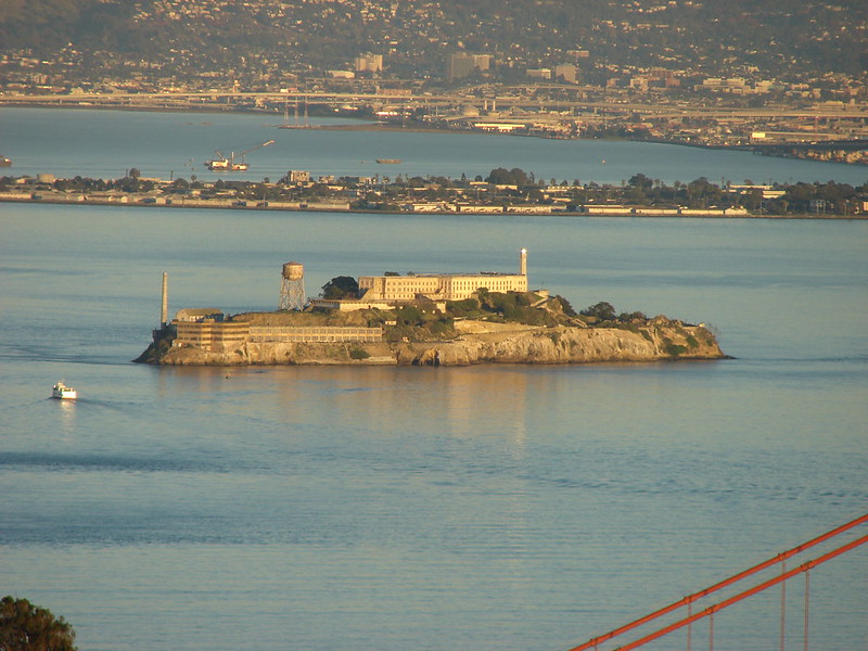 photo shows an aerial view of alcatraz island with the large stone structure in the center