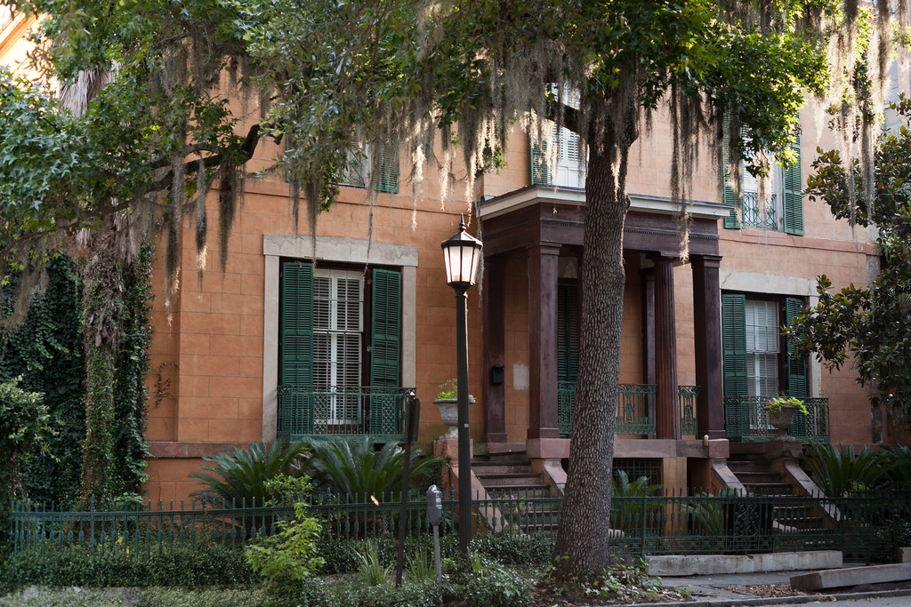 photo shows the sorrel weed house with spanish moss hanging from old oaks out front. 