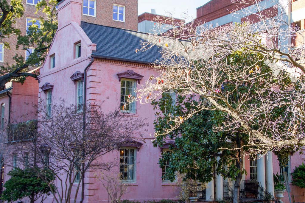 photo shows a huge pink brick mansion