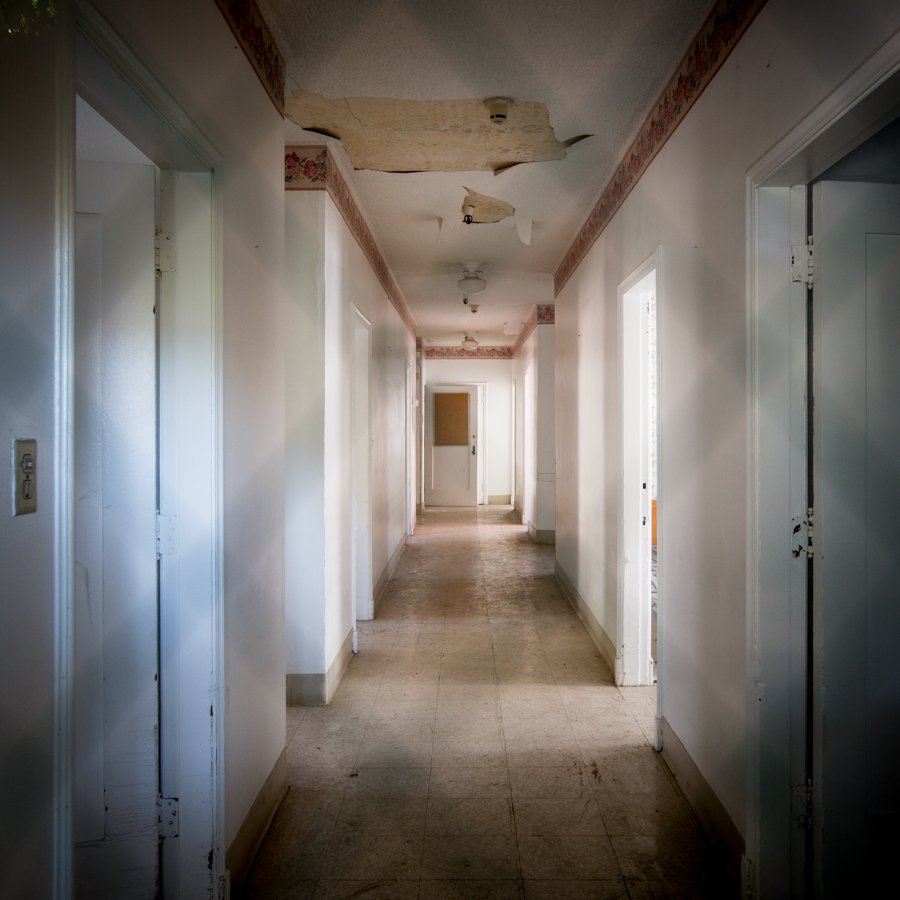photo shows a blurry hallway in the sanitarium