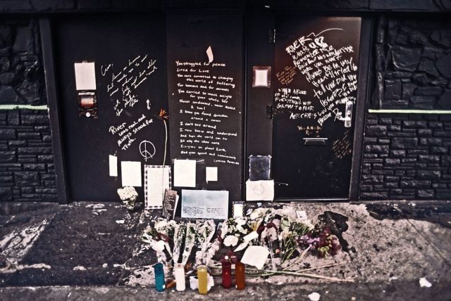 photo shows the spot where river phoenix collapsed,. notes and flowers are all over the spot as a makeshift memorial