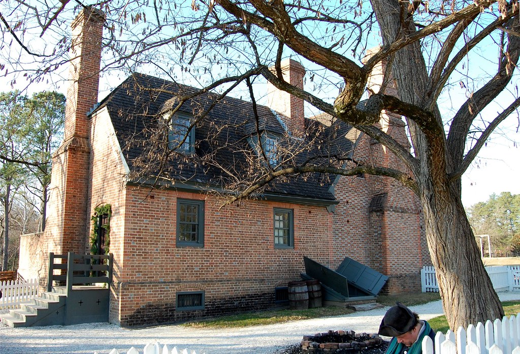 photo shows the side of the jail, a small brick building with two chimneys 