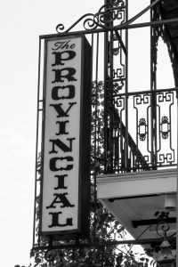 Black and white sign reading "Provincial" vertically