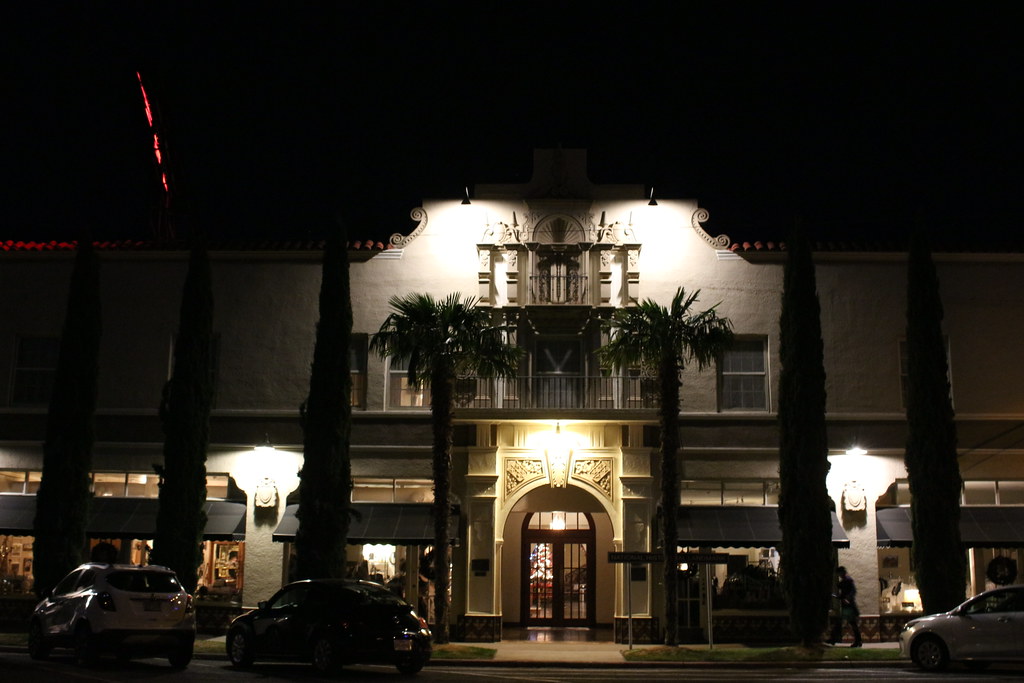 The Front Facade Of A Spanish Style Hotel At NIght
