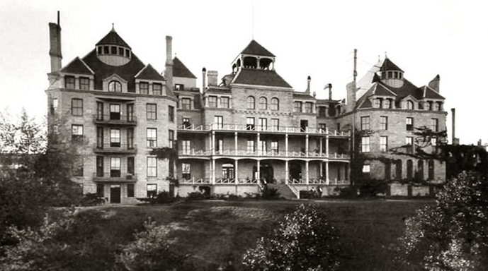 Black and white photo of old 19th century hotel