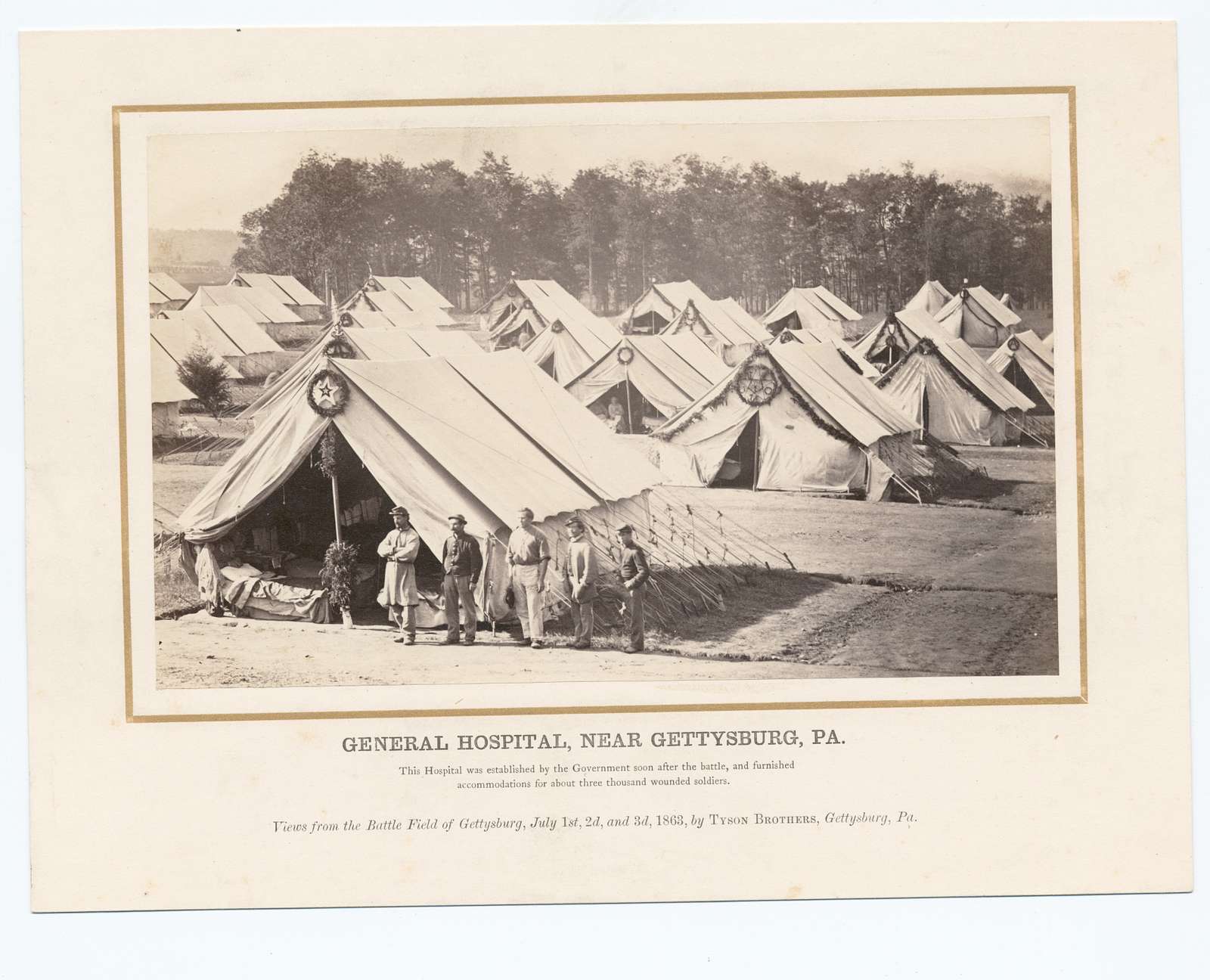 photo shows a field hospital at gettysburg, with a handful of white tents
