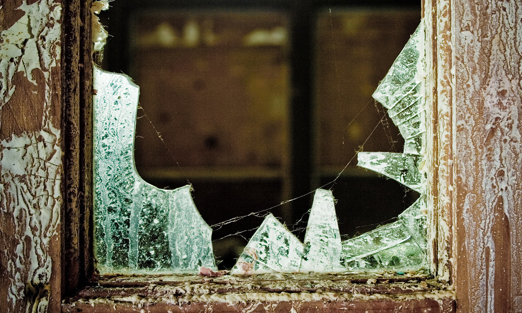 photo shows a broken window close up