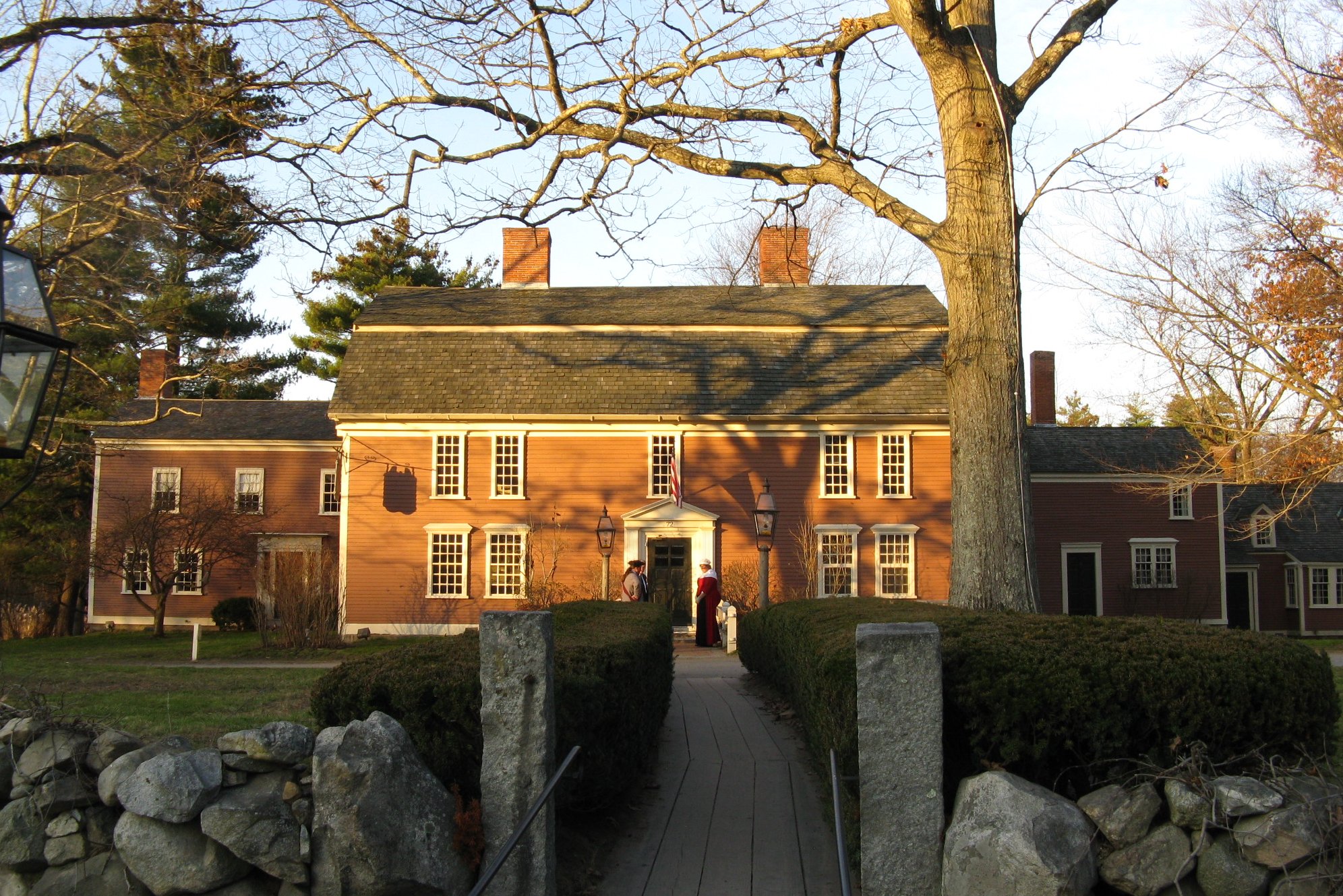 Longfellow’s Wayside Inn. A large brick building with a tree in front