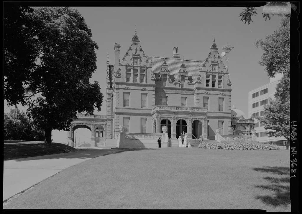 Black and white photo of a large Gothic mansion believed to be the Pabst Mansion in Milwaukee
