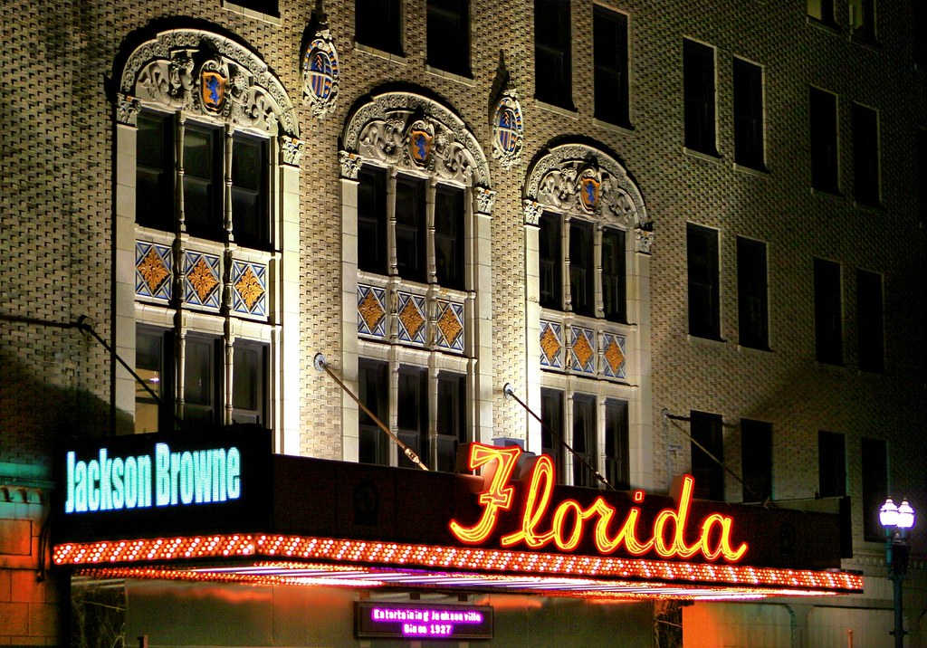 A building with a neon sign that says Florida